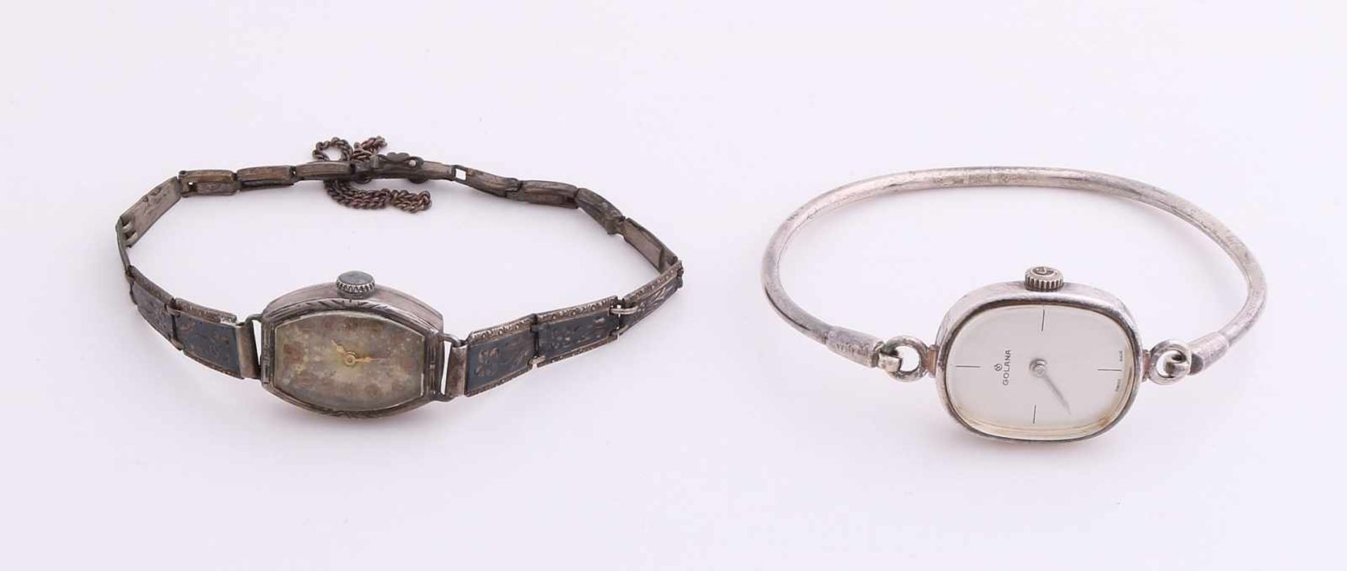 Zwei silberne Uhren; eine ovale Uhr, 925/000, mit starrem runden Armband, Marke Golana,