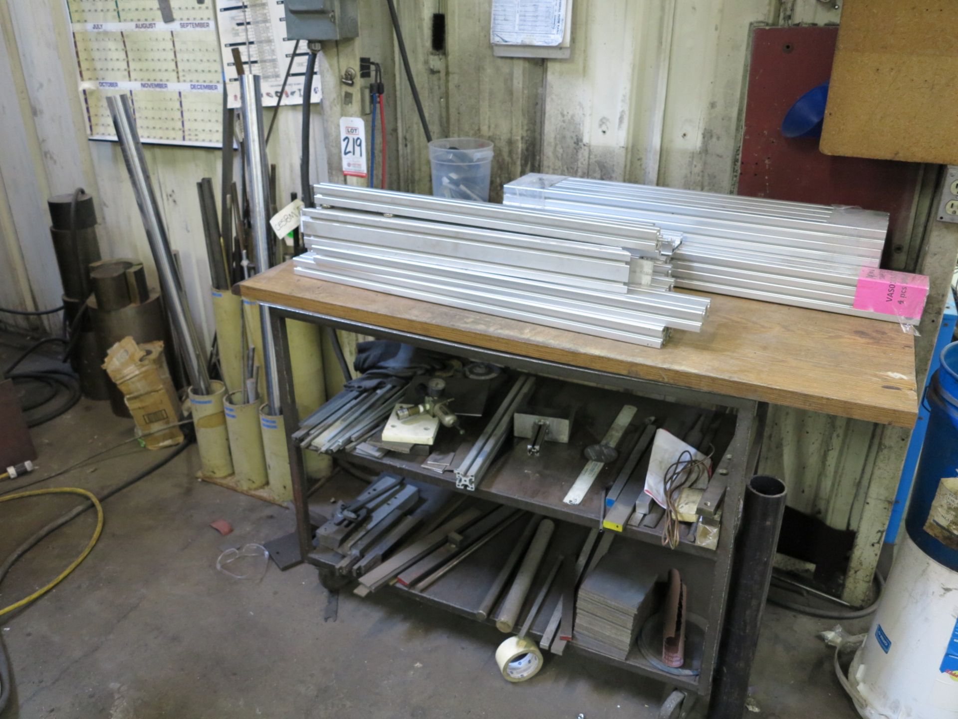 LOT - CART FULL OF SCRAP AND T-SLOT ALUMINUM FRAMING EXTRUSION AND THE BRASS, S.S. AND STEEL
