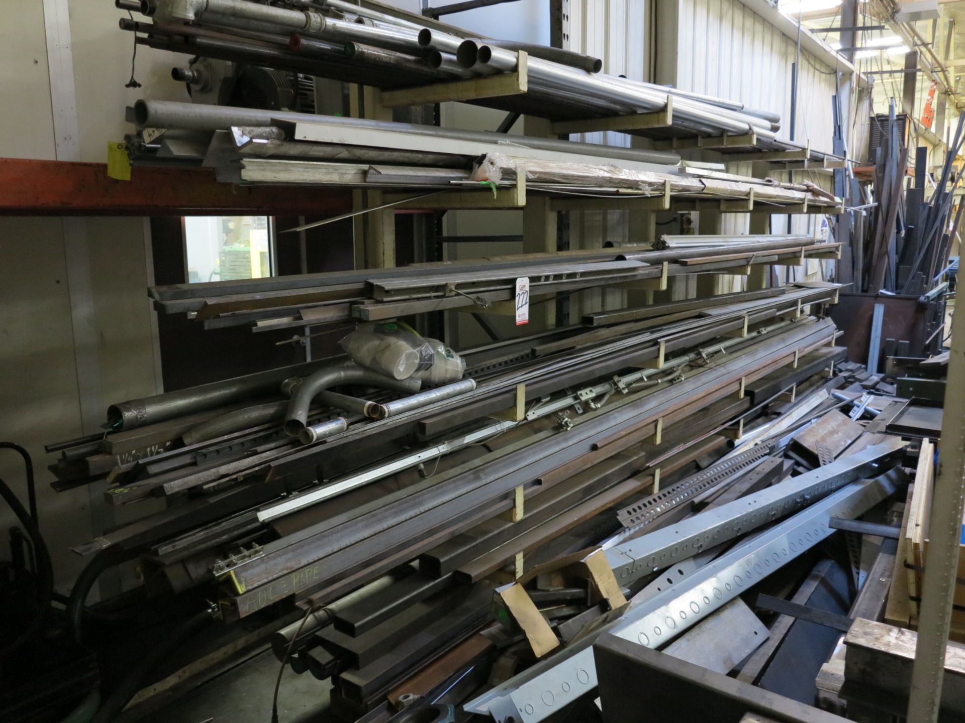 LOT - CANTILEVER MATERIAL RACK 16' LONG W/ 2' WELDED ARMS, W/ CONTENTS ON THE RACK ONLY, CONTENTS