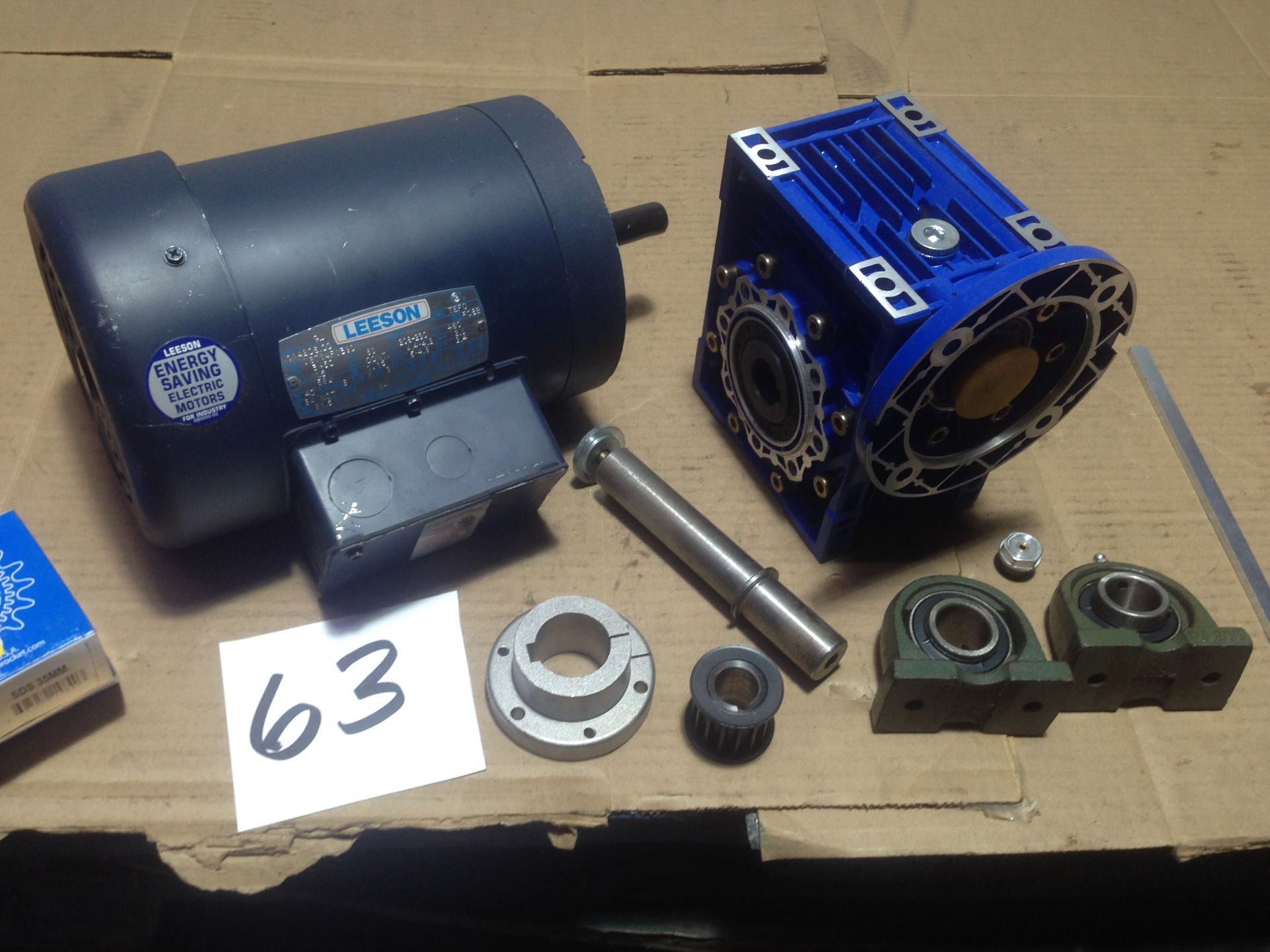 LOT - LEESON 1.5 HP 230V 1PH ELECTRIC MOTOR (NEW) AND MNRV 63 GEARBOX (NEW)