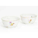 PAIR OF PORCELAIN BOWLS WITH FLOWER AND MOULD DECOR.