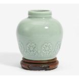 SMALL VASE WITH MODELED LOTUS BLOSSOMS IN FLAT RELIEF.