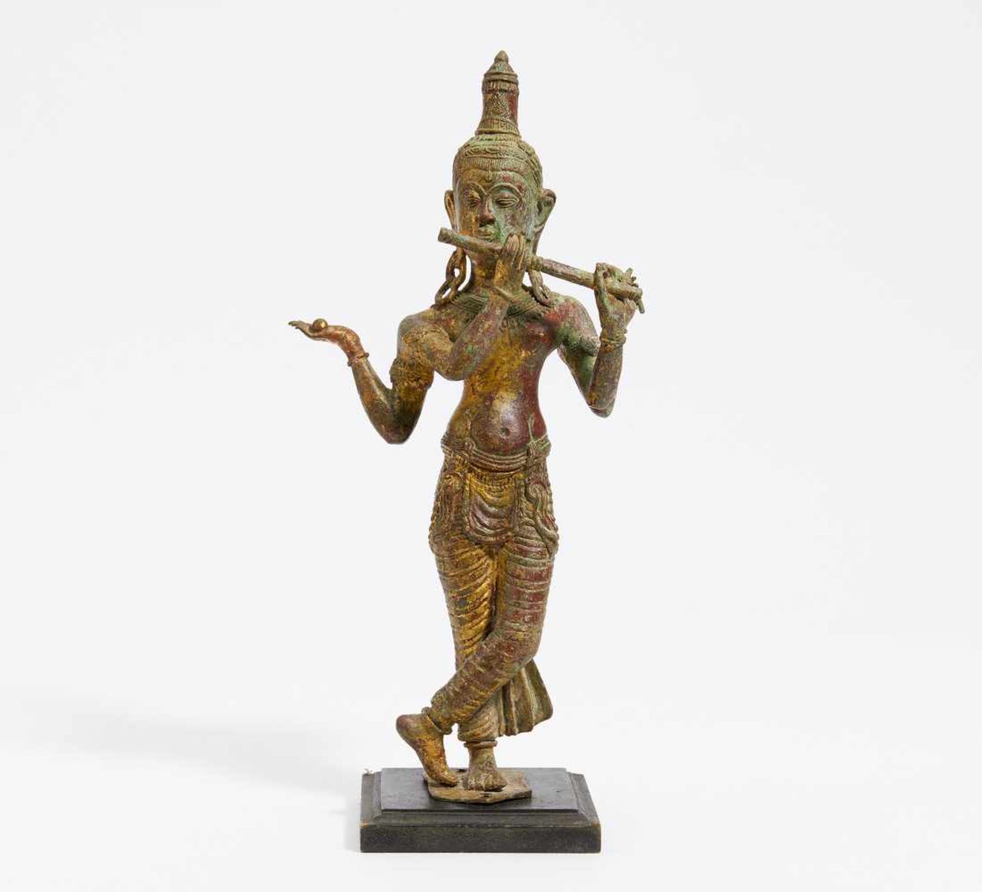 FOUR ARMED DEITY WITH FLUTE.