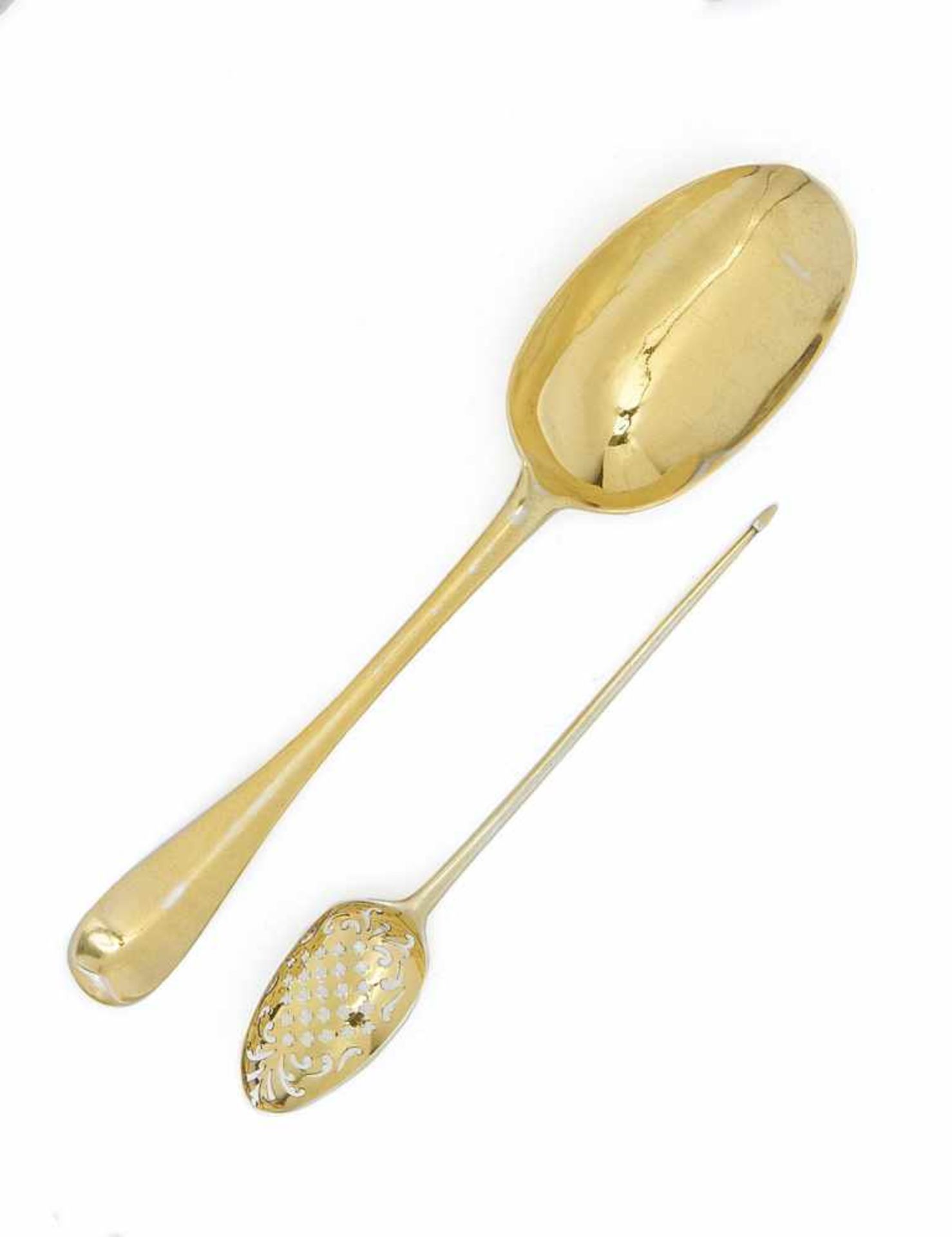 GILT STRAINER SPOON AND LARGE GILT SPOON.