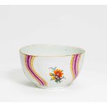 PORCELAIN BOWL WITH FLOWER AND RIBBON DECOR.