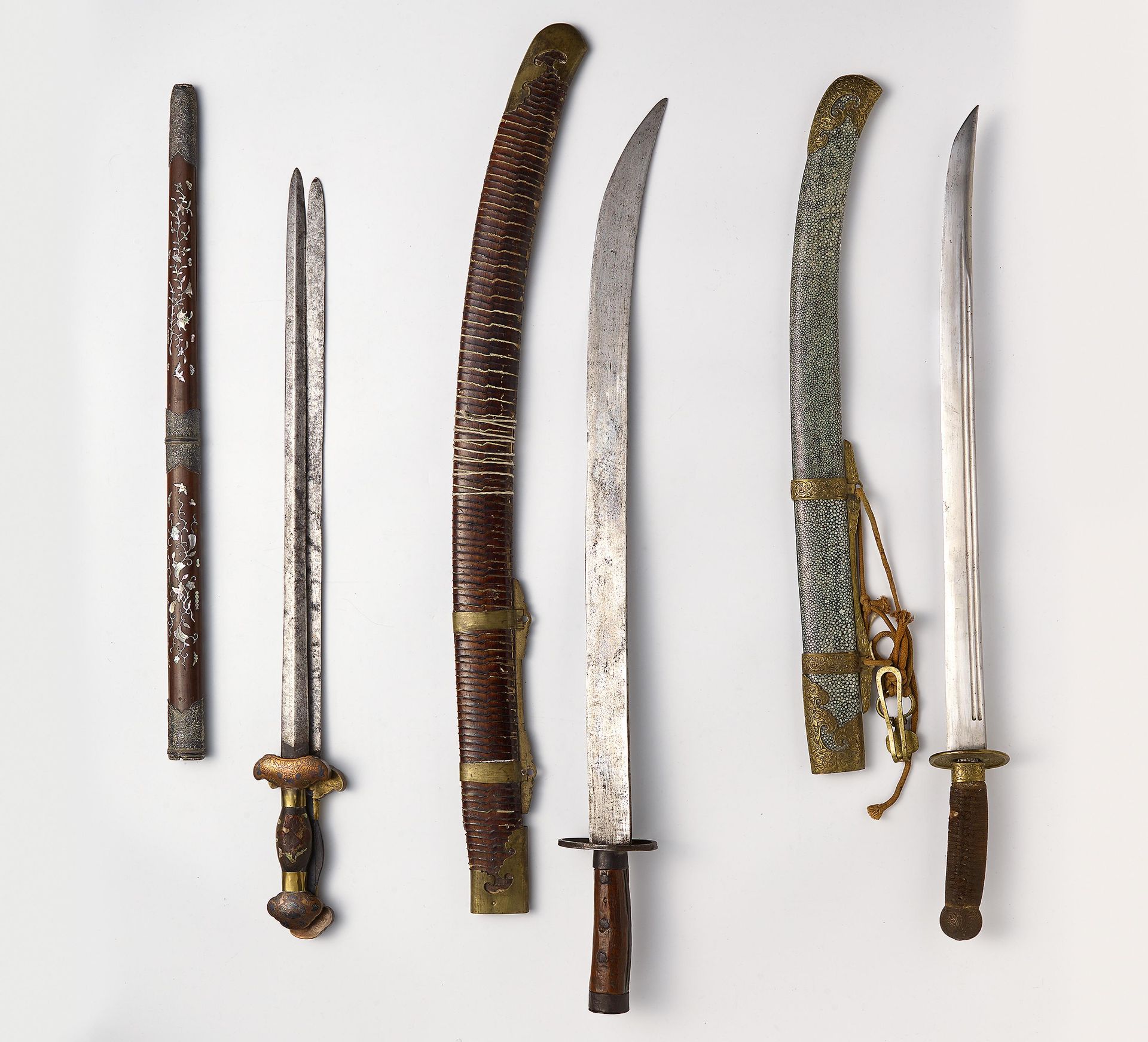 ONE STRAIGHT DOUBLE AND TWO CURVED SWORDS WITH SHEATHS. Origin: China. Dynasty: Qing dynasty.
