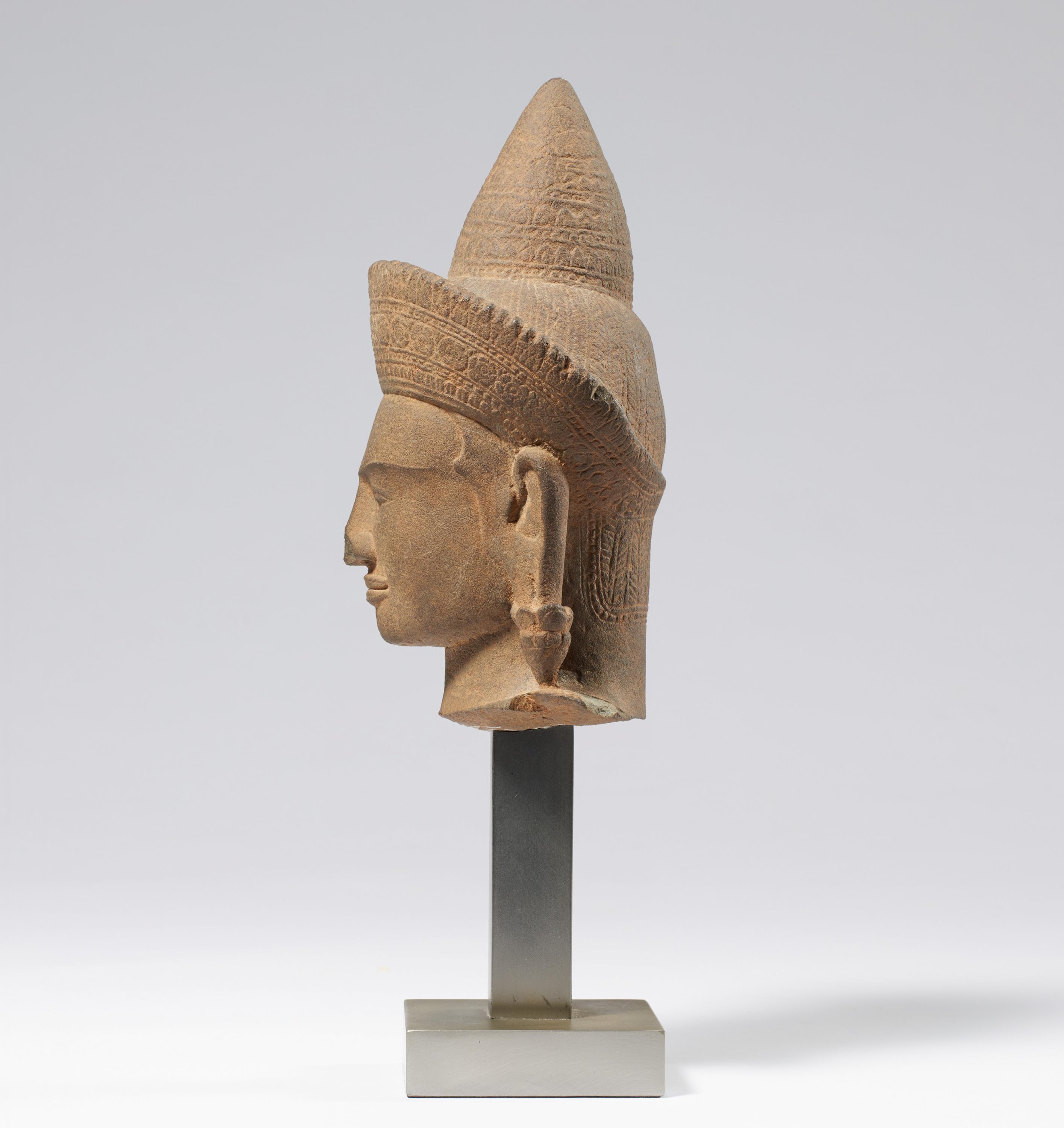 HEAD OF A CROWNED GODDESS. Origin: Khmer. Dynasty: Angkor Wat period (1100-1175). Date: 12th c. - Image 3 of 5