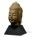 IMPORTANT LARGE HEAD OF A BUDDHA. Origin: China. Dynasty: Northern Qi/early Sui dynasty. Date: 6th