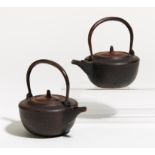 PAIR OF SMALLER SAKE KETTLES (CHÔSHI). Origin: Japan. Dynasty: Edo period (1603-1868). Technique: