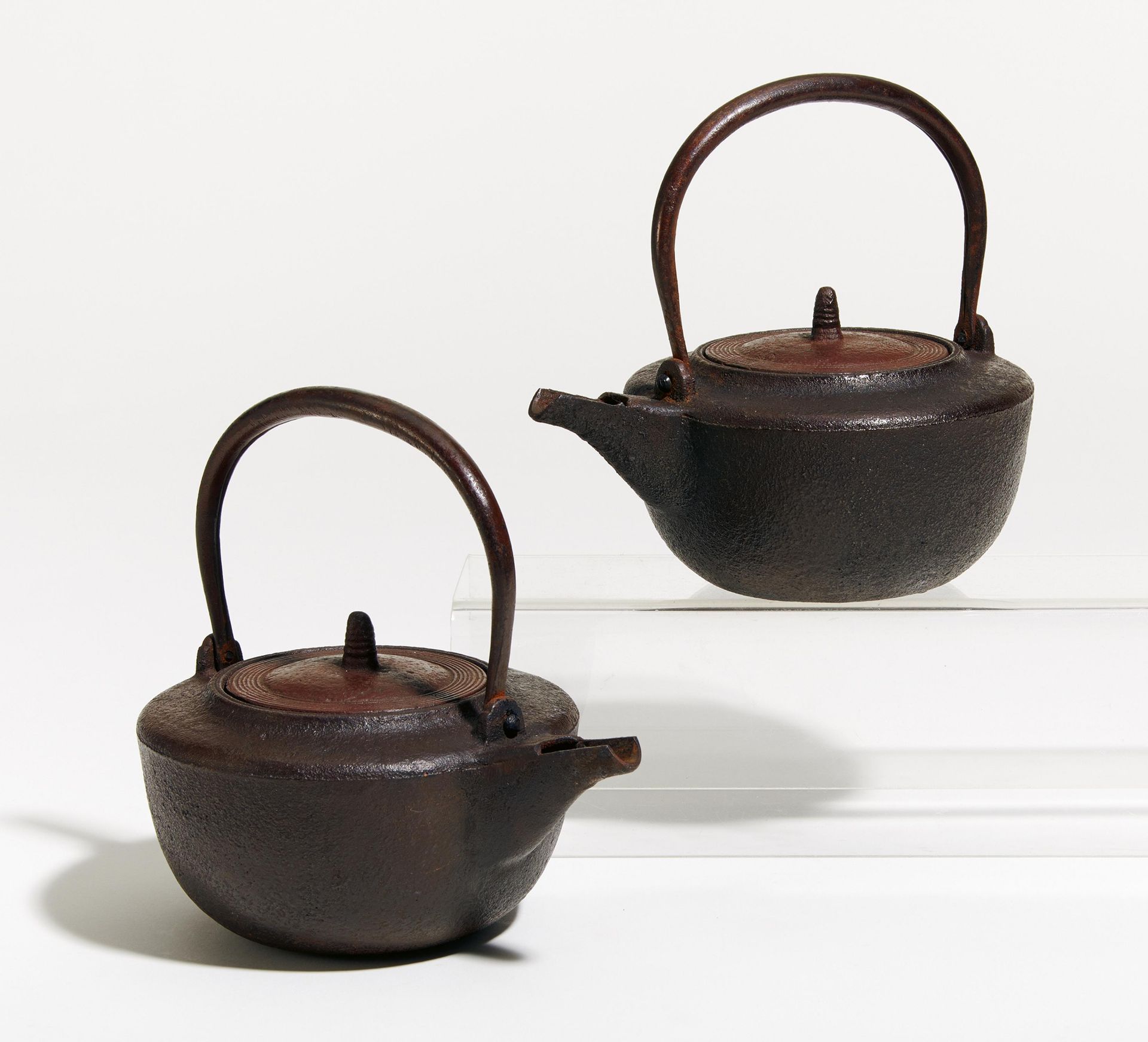 PAIR OF SMALLER SAKE KETTLES (CHÔSHI). Origin: Japan. Dynasty: Edo period (1603-1868). Technique: