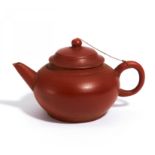 SMALL ZISHA TEA POT. Origin: China. Swatow. Date: 20th c. Technique: Cinnabar red fine stoneware.