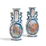 PAIR OF BEGONIA SHAPED VASES WITH HANDLES. Origin: China. Dynasty: Qing dynasty. Date: Qianlong