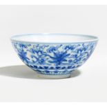 SMALL BOWL WITH LILY SCROLLS. Origin: China. Technique: Porcelain painted in underglaze blue.