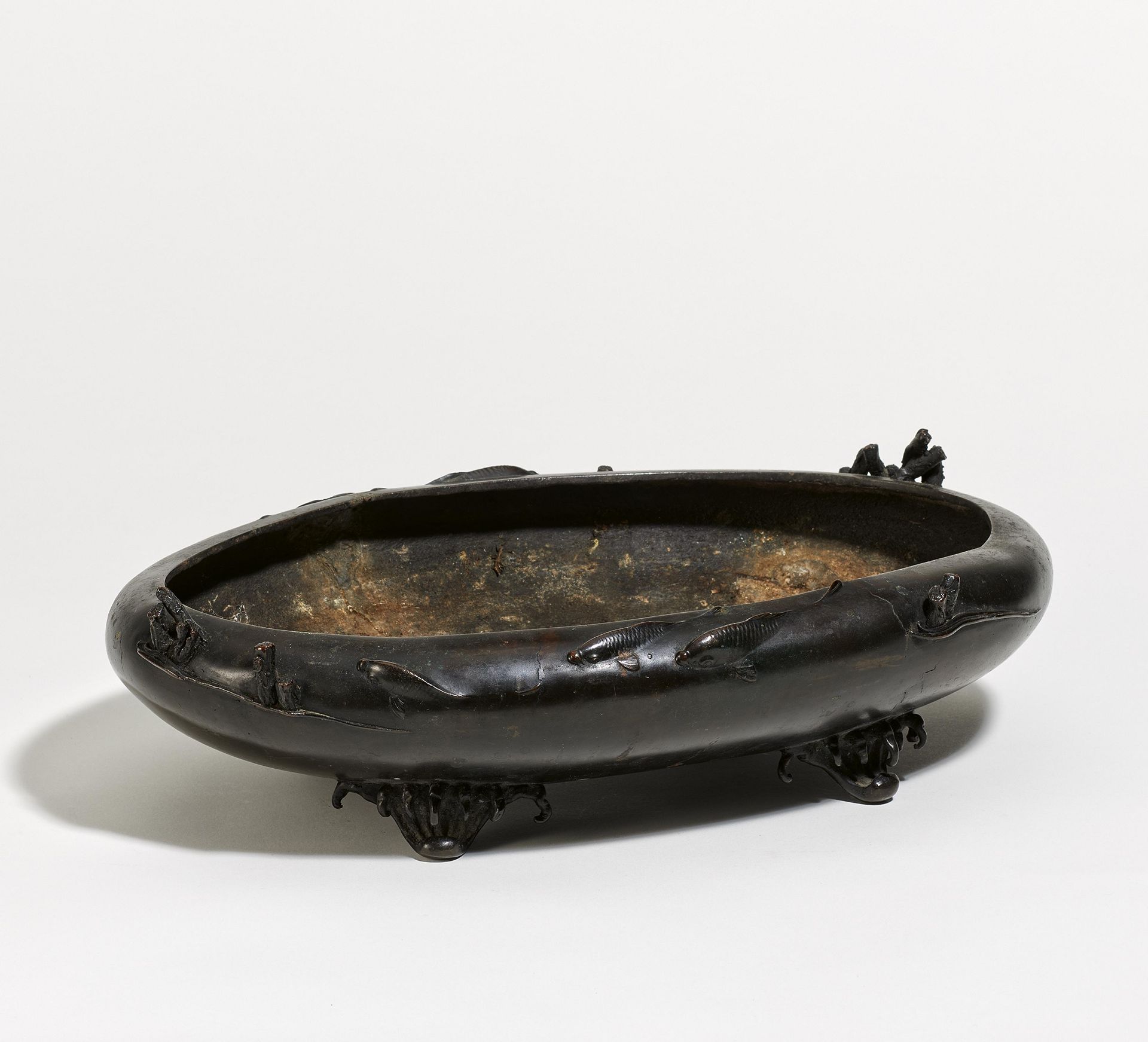 OVAL BOWL WITH CARP AND WAVES. Origin: Japan. Dynasty: Meiji period (1868-1912). Technique: Bronze