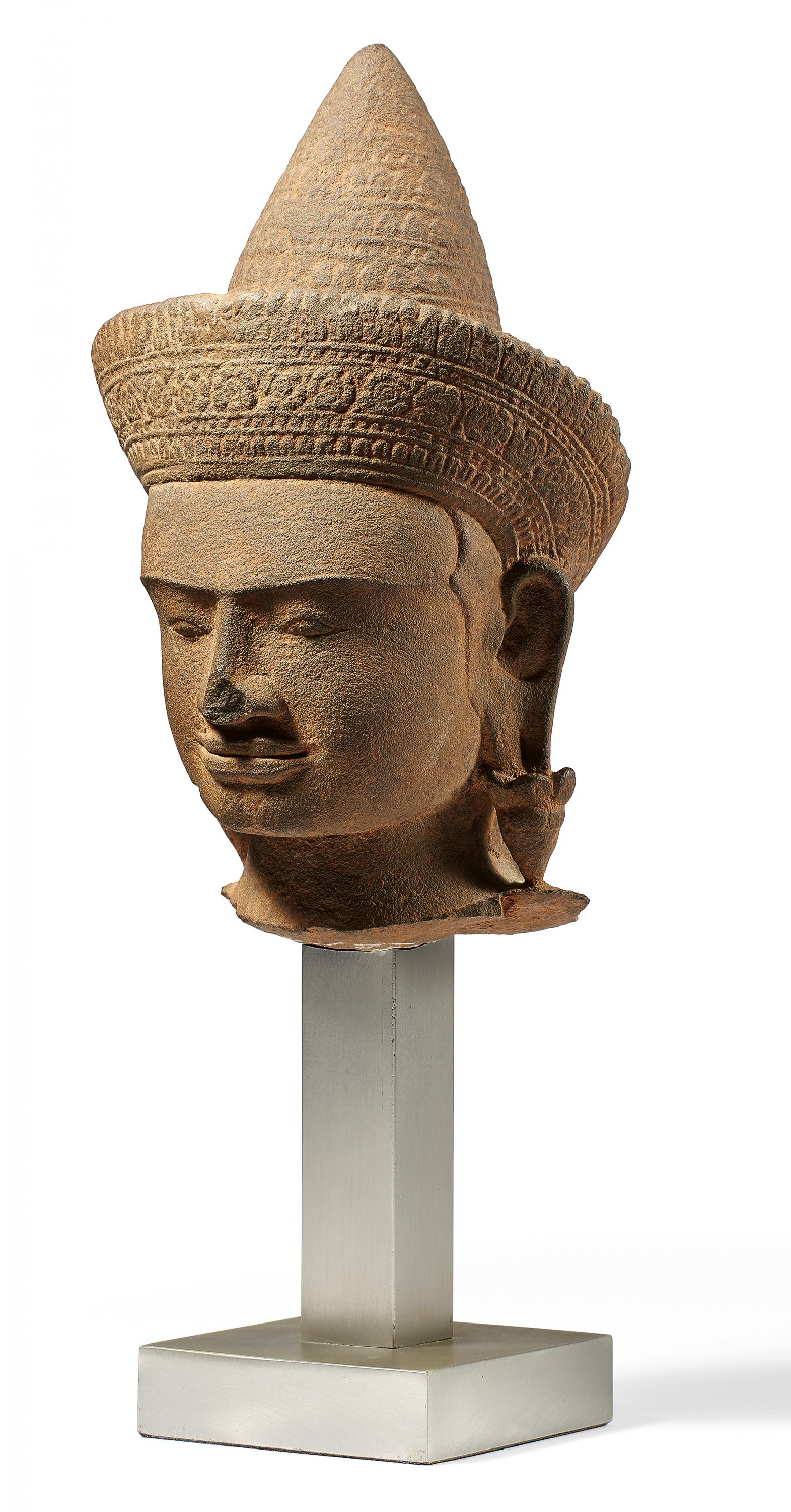 HEAD OF A CROWNED GODDESS. Origin: Khmer. Dynasty: Angkor Wat period (1100-1175). Date: 12th c.