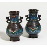 PAIR OF BRONZE VASES WITH TAOTIE MASKS AND DRAGONS HANDLES. Origin: Japan. Date: 19th/20th c.