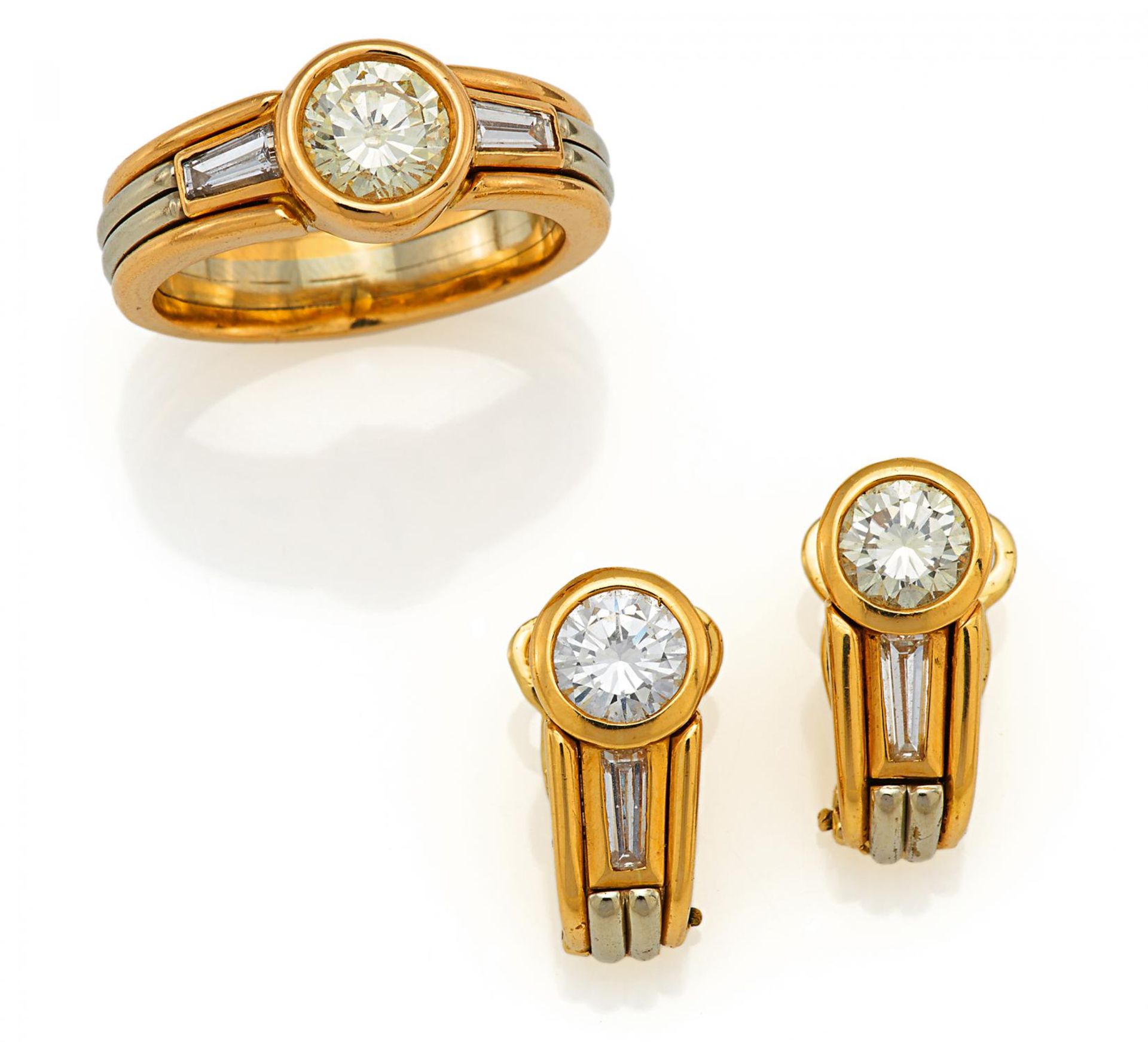 DIAMOND-RING AND EAR STUDS. Origin: Germany. Date: 1990s. Material: 750/- yellow- and white gold,