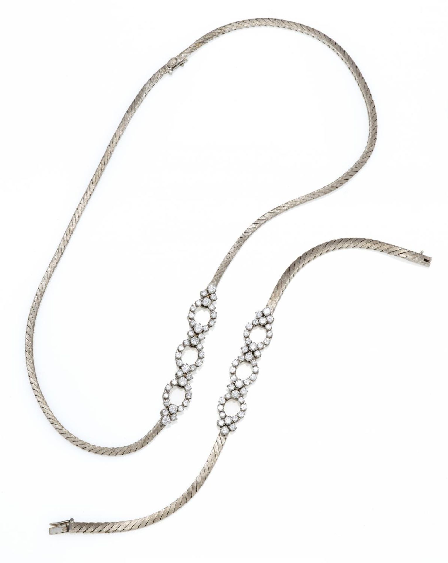 DIAMOND-SET: NECKLACE AND BRACELET. Origin: Germany. Date: 1990s. Material: 750/- white gold, with