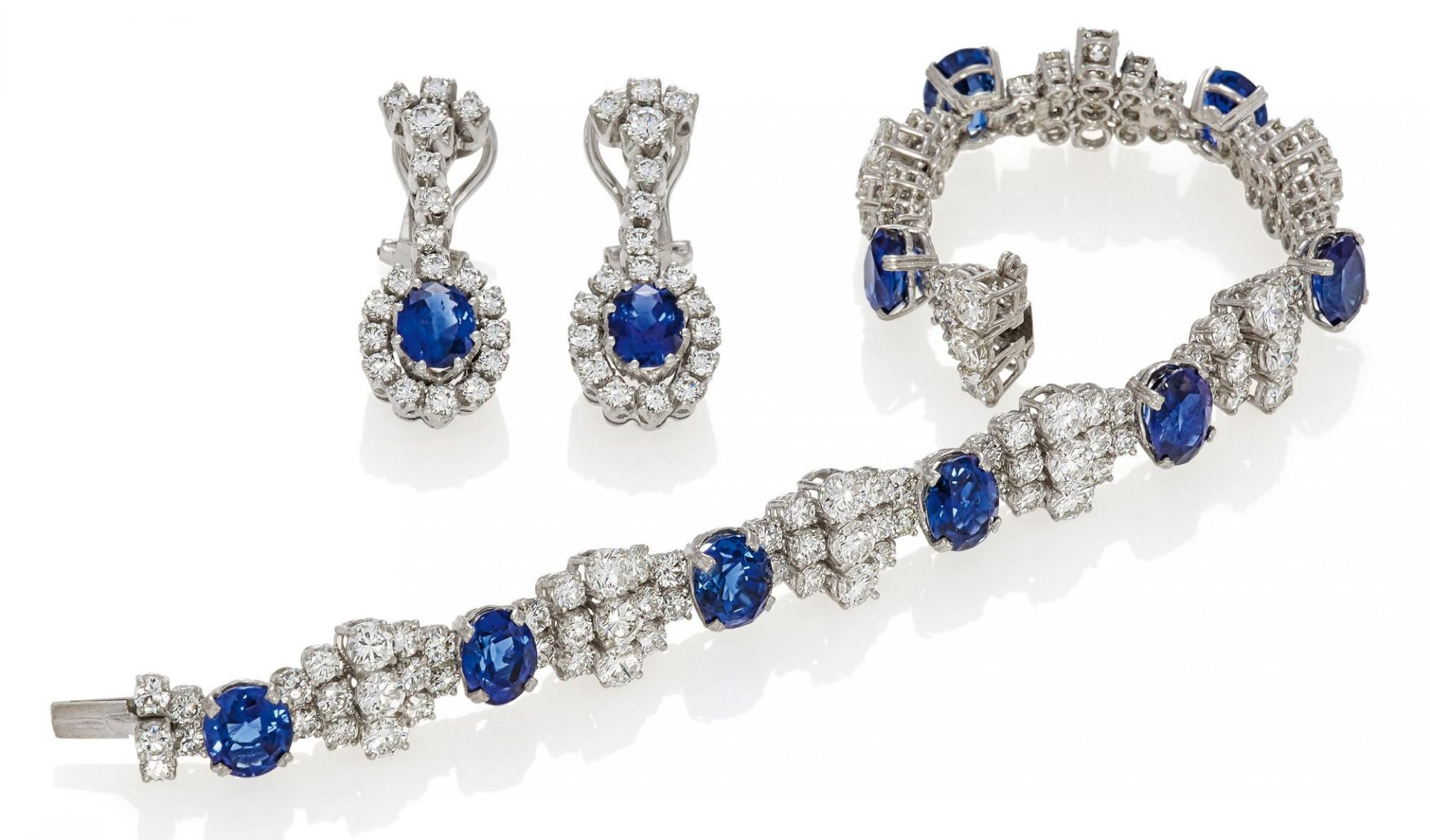 SAPPHIRE-DIAMOND-SET: BRACELET AND EAR CLIP-ONS. Origin: Germany. Date: 1980s. Material: Bracelet