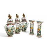 HIGHLY DECORATIVE FIVE-PIECE PORCELAIN VASE GARNITURE. Presumably France. Technique: Porcelain