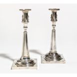 PAIR OF SILVER CANDLESTICKS WITH CONICAL SHAFT AND LION DECOR. Germany. Date: Late 19th century.