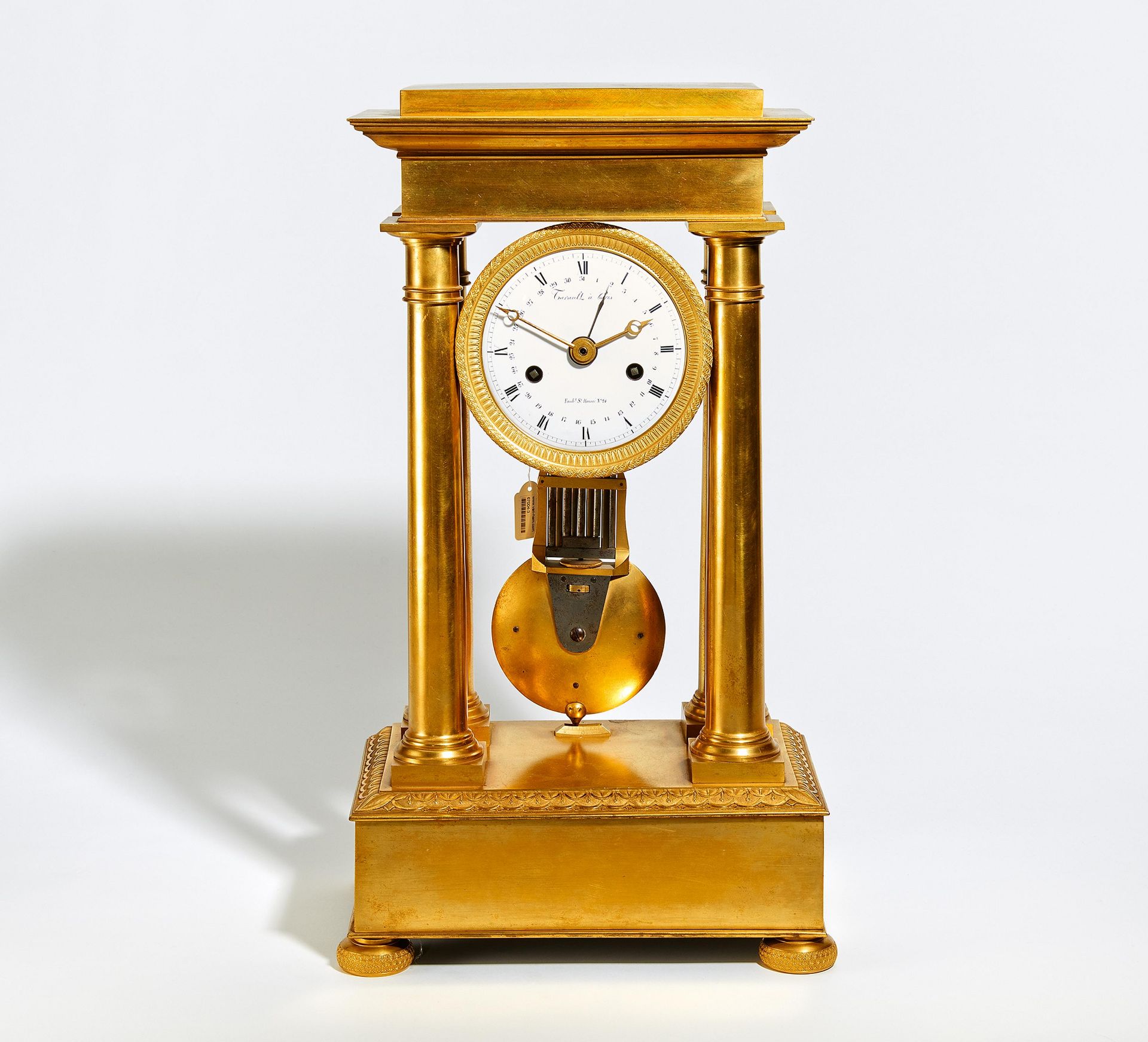 EMPIRE PORTAL PENDULUM CLOCK MADE OF GILT BRONZE. Paris. Date: Around 1810. Maker/Designer: