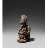 YORUBA, Nigeria. Maternity figure, fragment of an Ifa-oracle-bowl. Wood, dark patina. 24 x 11 x 14,