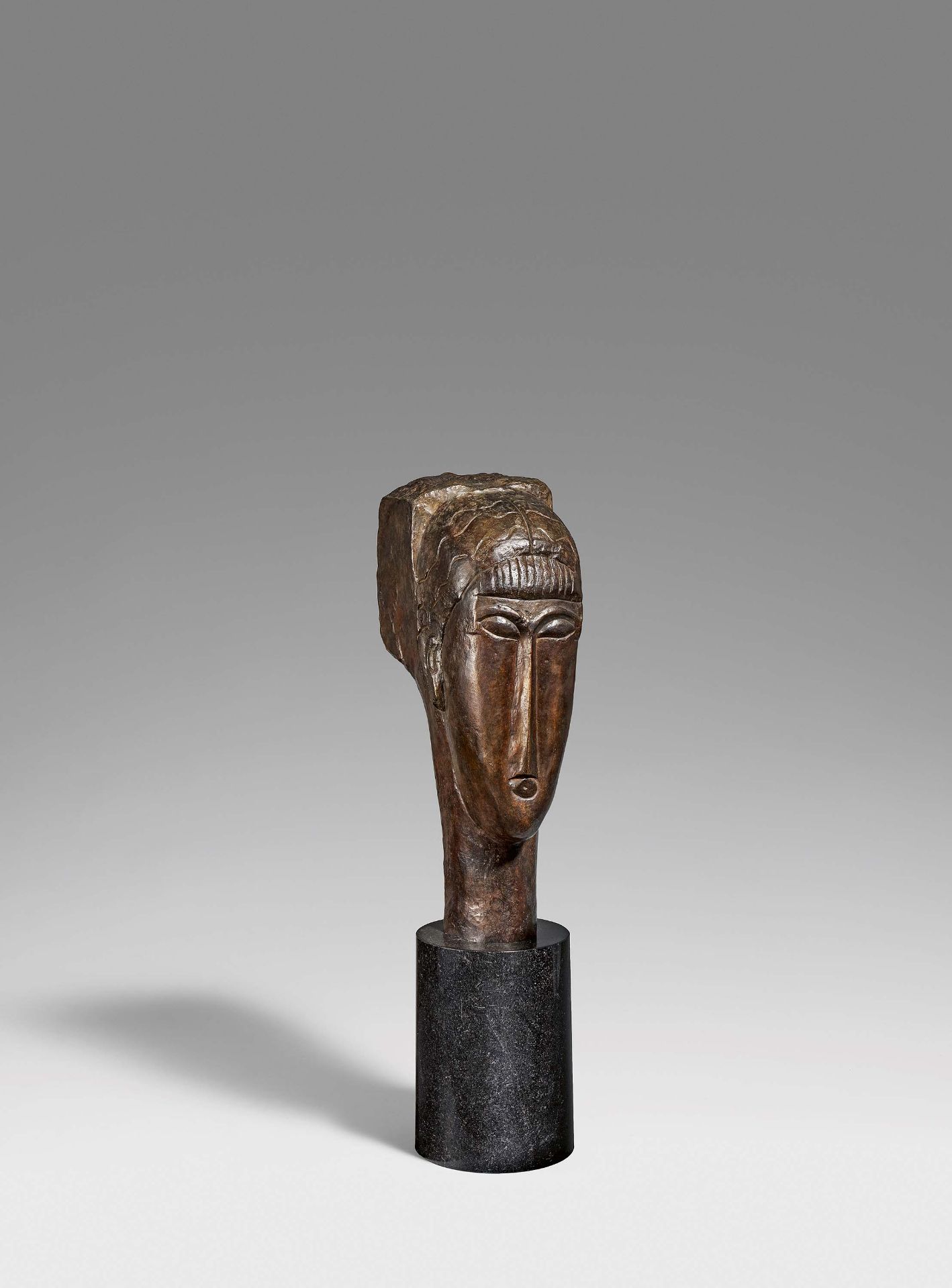 Modigliani, Amedeo1884 Livorno - 1920 ParisTête de jeune fille à la frange. Bronze, dark brown