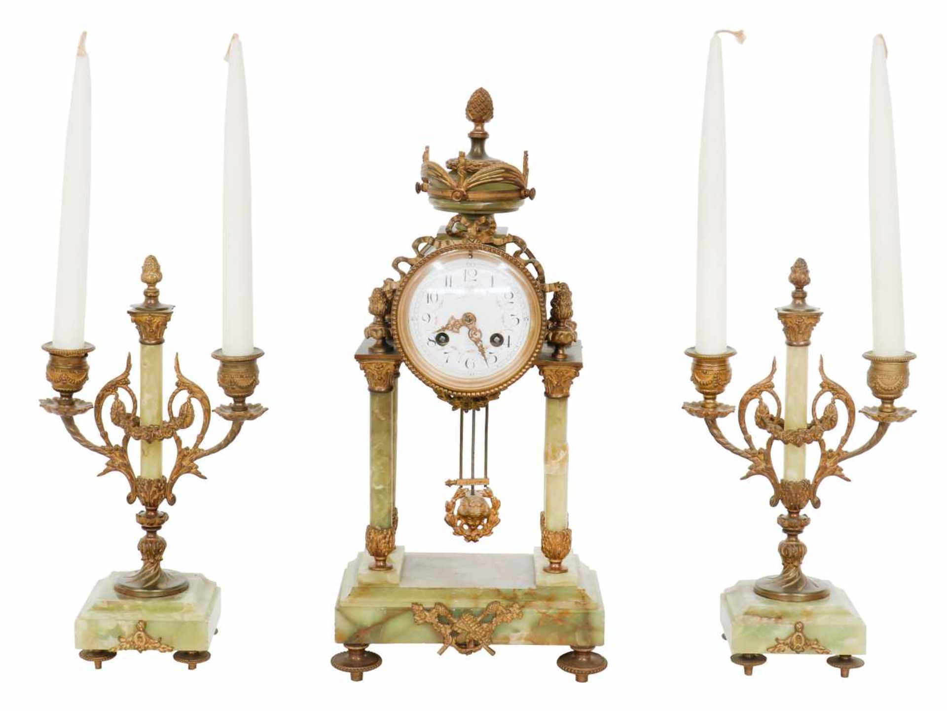 A mantel clock set with green onyx. France, late 19th century.