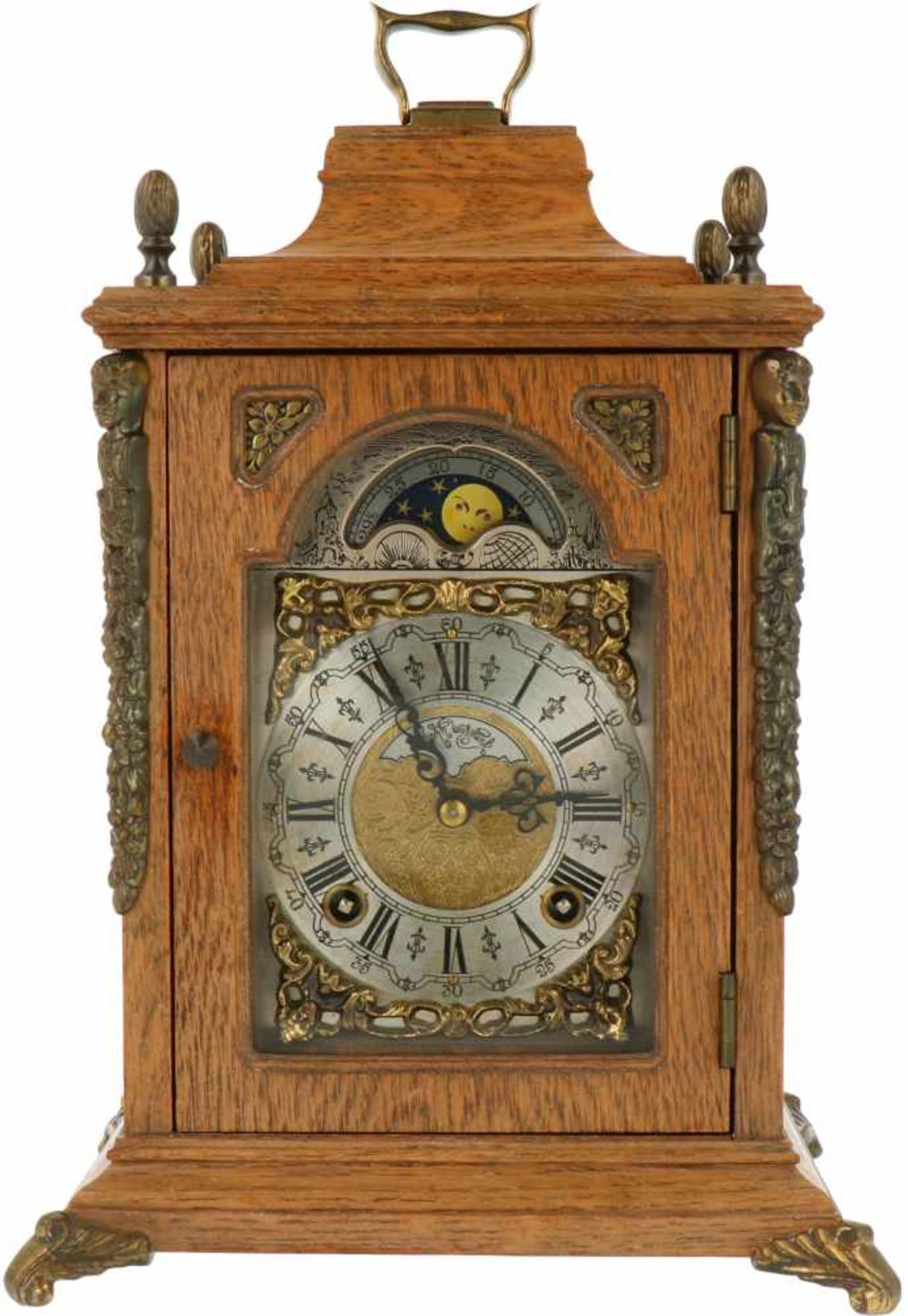 A wood table clock with bronze ornaments. Warmink, mid 20th century.