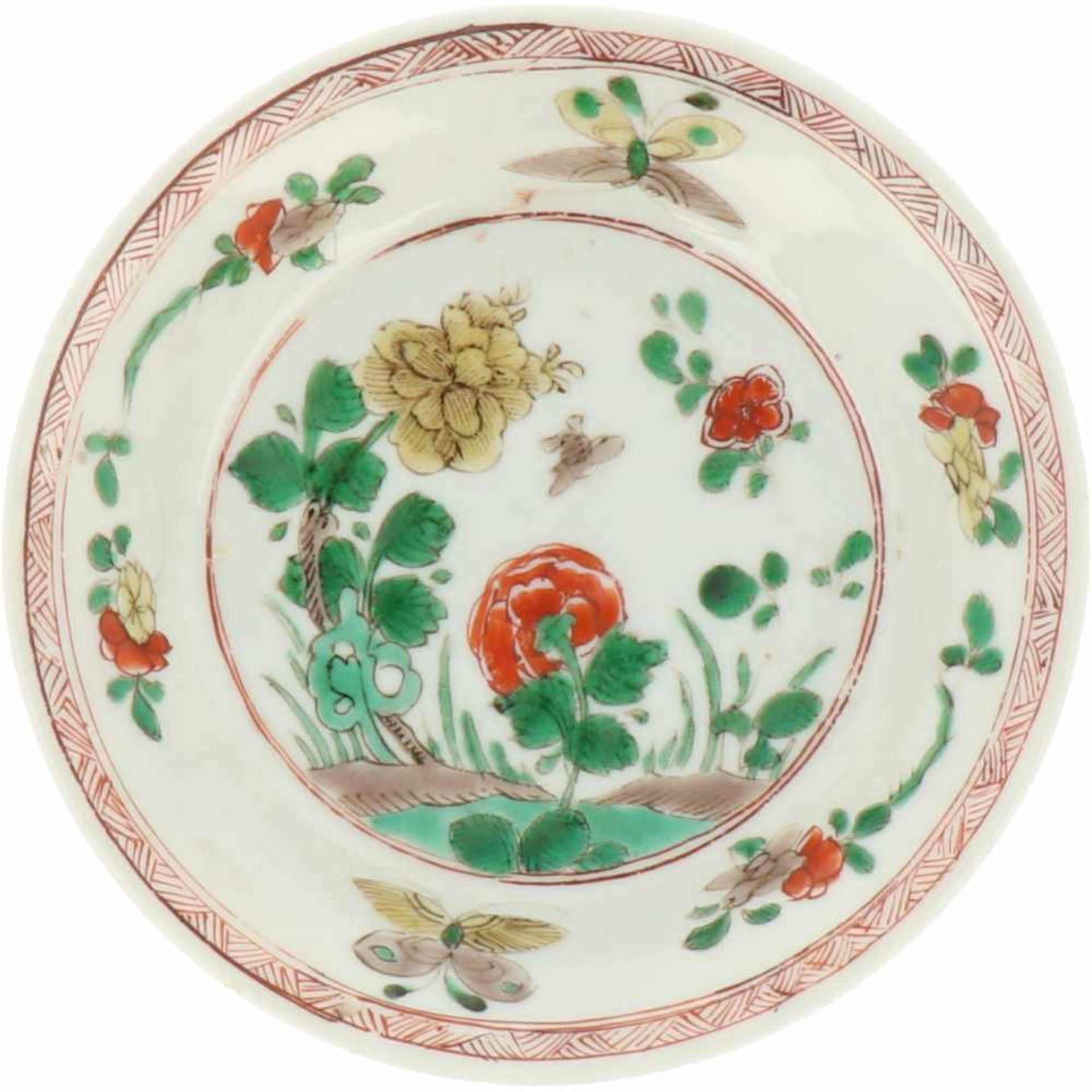 A porcelain plate with décor in Famille Verte. China, Kangxi.<
