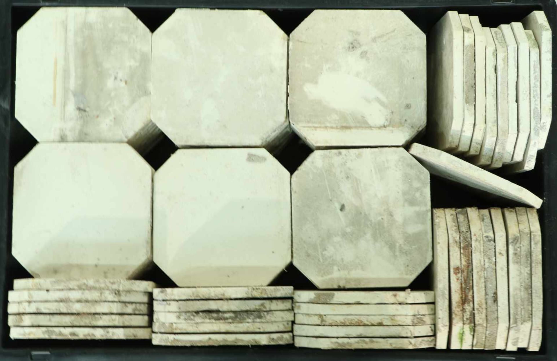 A large amount of white octagonal wall tiles.