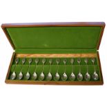 (12) Piece set of silver spoons decorated with flowers.