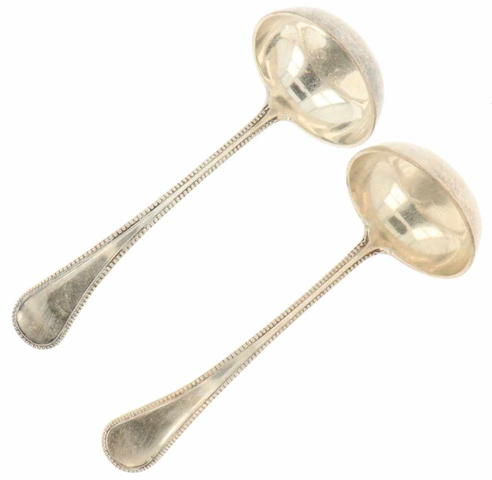 (2) Silver sauce spoons.