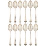 (12) Piece set of silver dessert spoons.