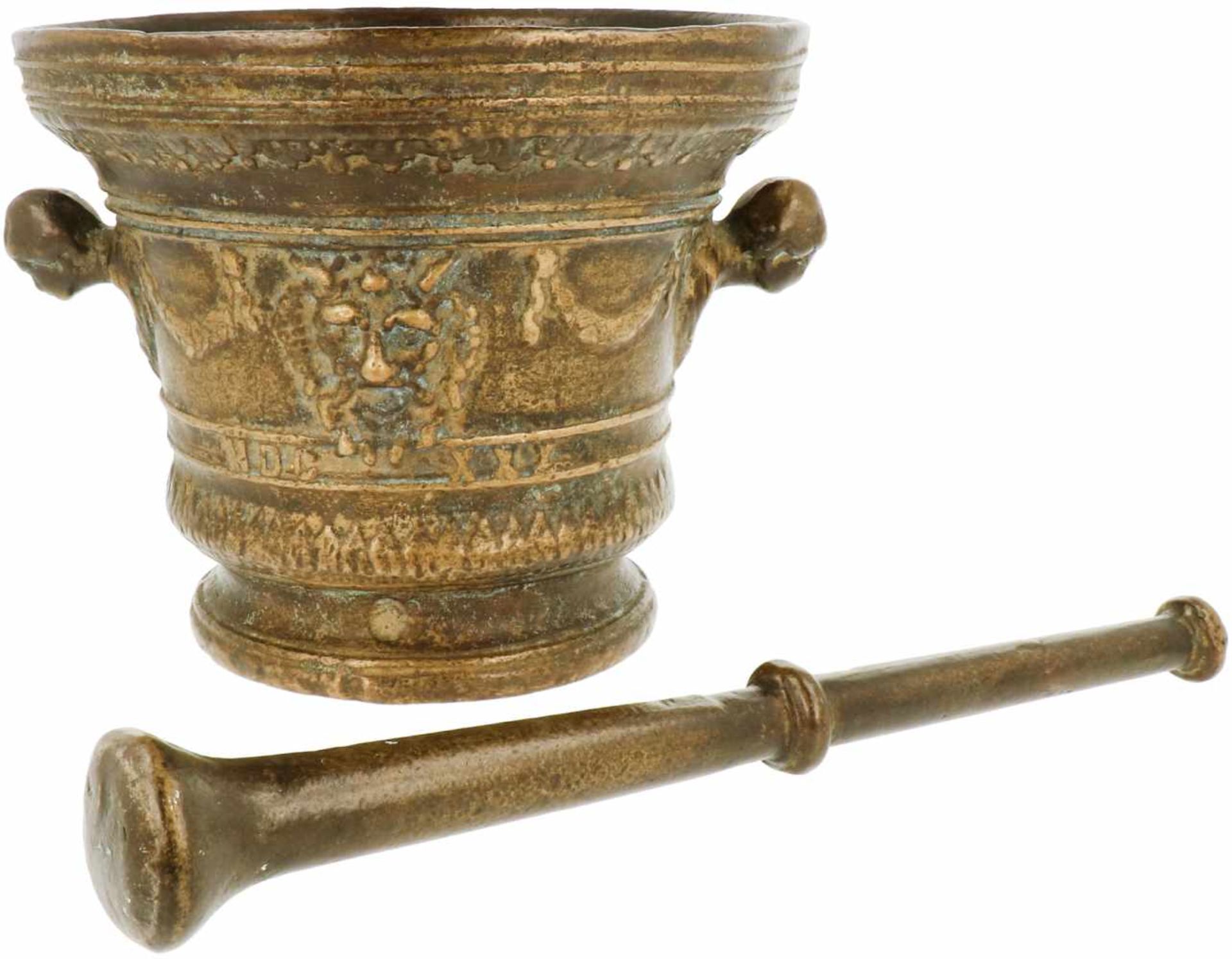 An impressive bronze mortar decorated with ornamental heads. With pestle. 19th century. - Bild 2 aus 2