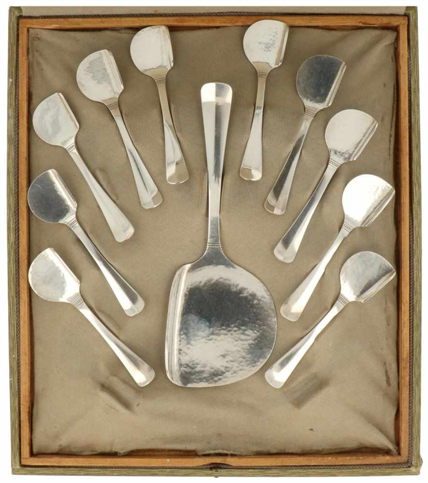 (11) Piece silver flatware set, twelve spoons and a serving scoop.