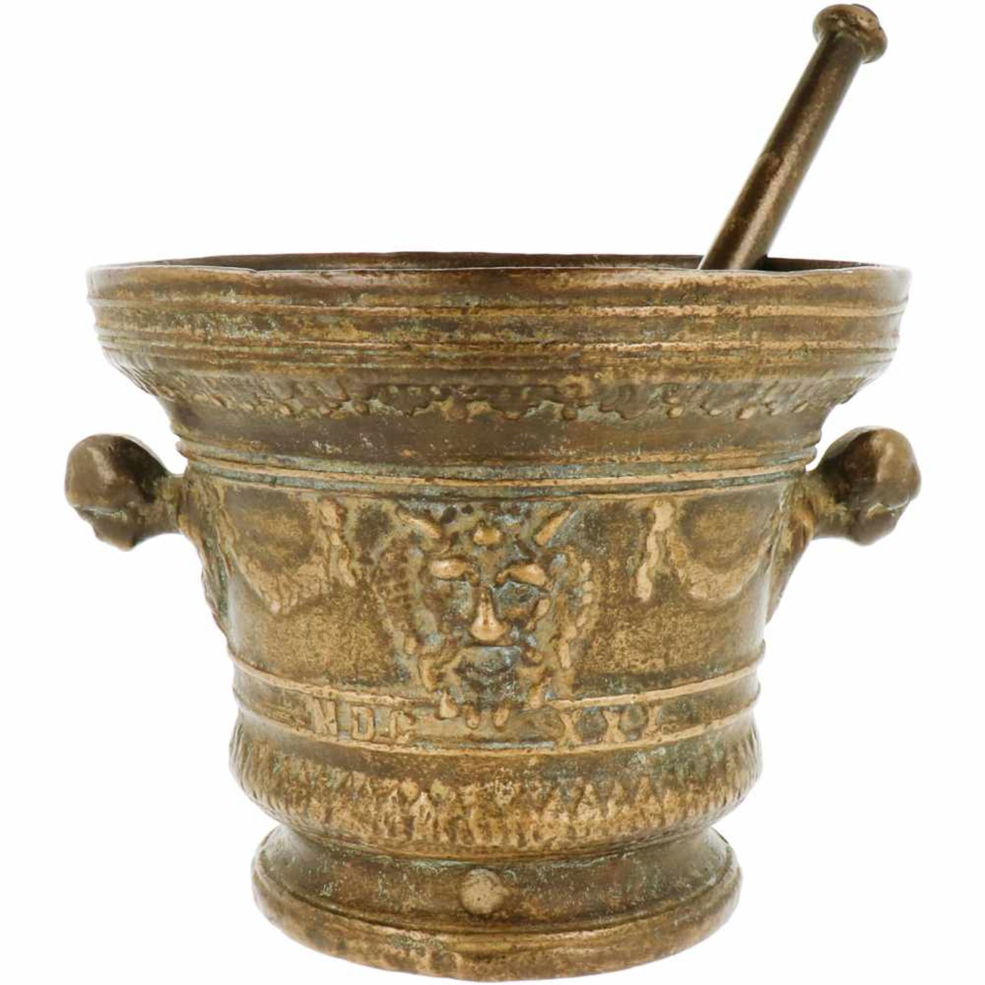 An impressive bronze mortar decorated with ornamental heads. With pestle. 19th century.