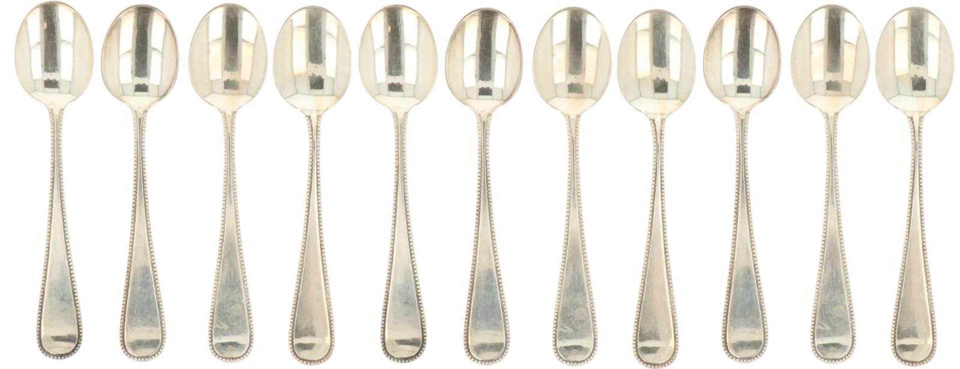 (11) Piece set of silver dessert spoons.