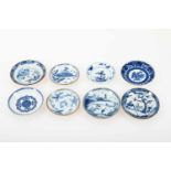 Een lot van (8) porseleinen Batavia ware schoteltjes met onder andere sybille merian decor. China,