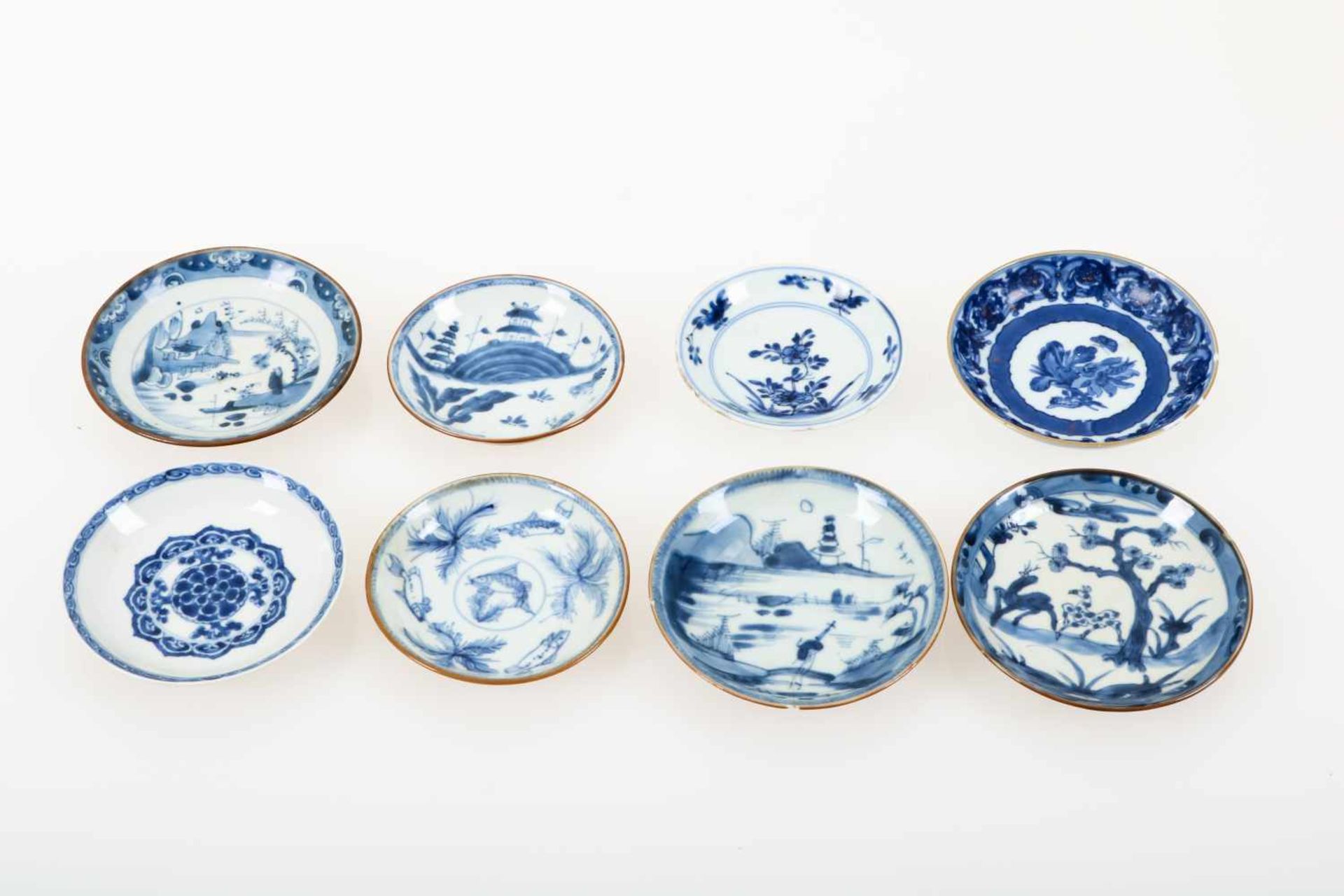 Een lot van (8) porseleinen Batavia ware schoteltjes met onder andere sybille merian decor. China,