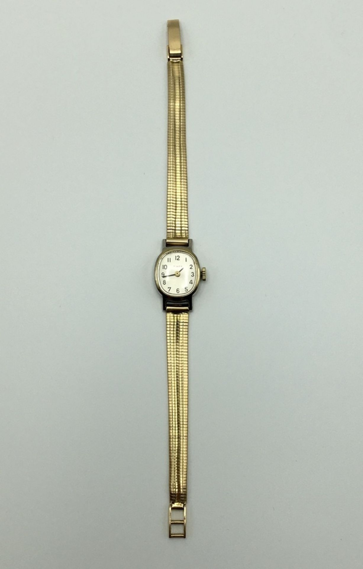 (Goud) Goud, dameshorloge Timex met massief gouden horlogeband, midden 20e eeuw. Verona Italië