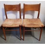 (Design) StoelenTwee teakhouten stoelen met biezen zitting. Conditie: In gebruikte staat. Afmet