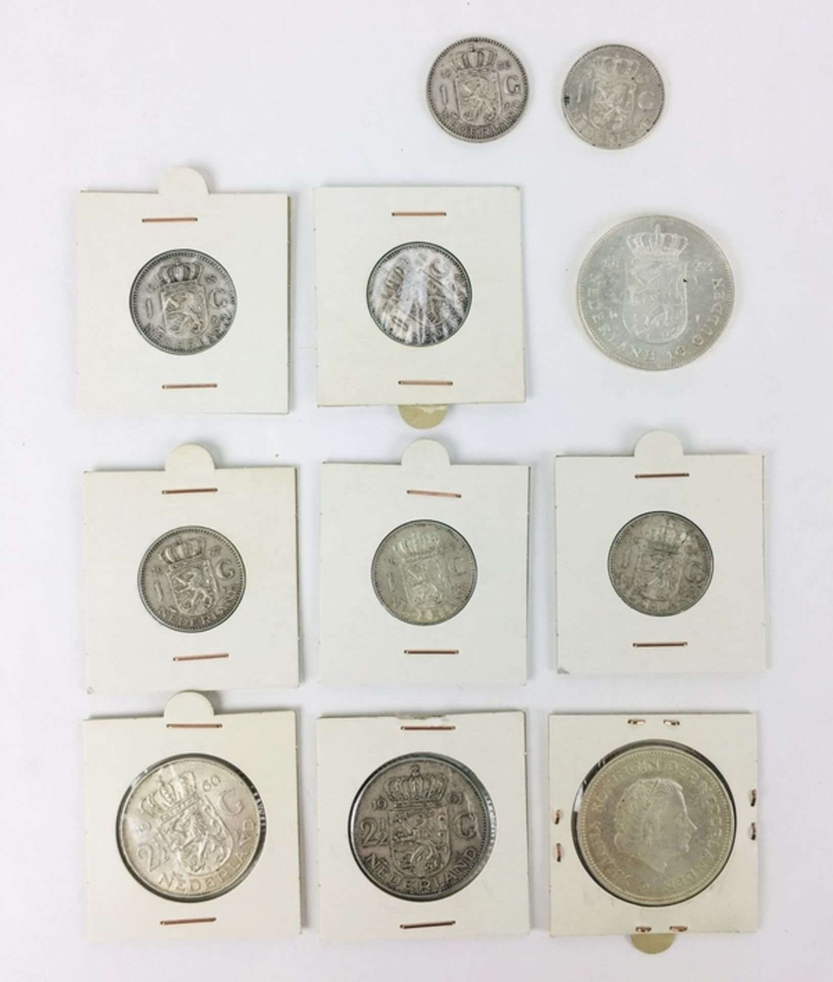 (Zilver) Zilveren muntenZeven guldens, twee rijksdaalders en twee tientjes. Conditie: Prachtig.