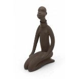 Jaap Ravelli (1916-2011)A ceramic figure of a seated African female nude, with copper necklace,
