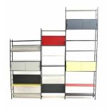 Tjerk ReijengaA modular grey, black, red, yellow and white lacquered metal wall system comprising