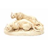 Royal Dux, BohemiaA moulded ceramic group of two lionesses, designed by Otto Jarl (1856-1915),