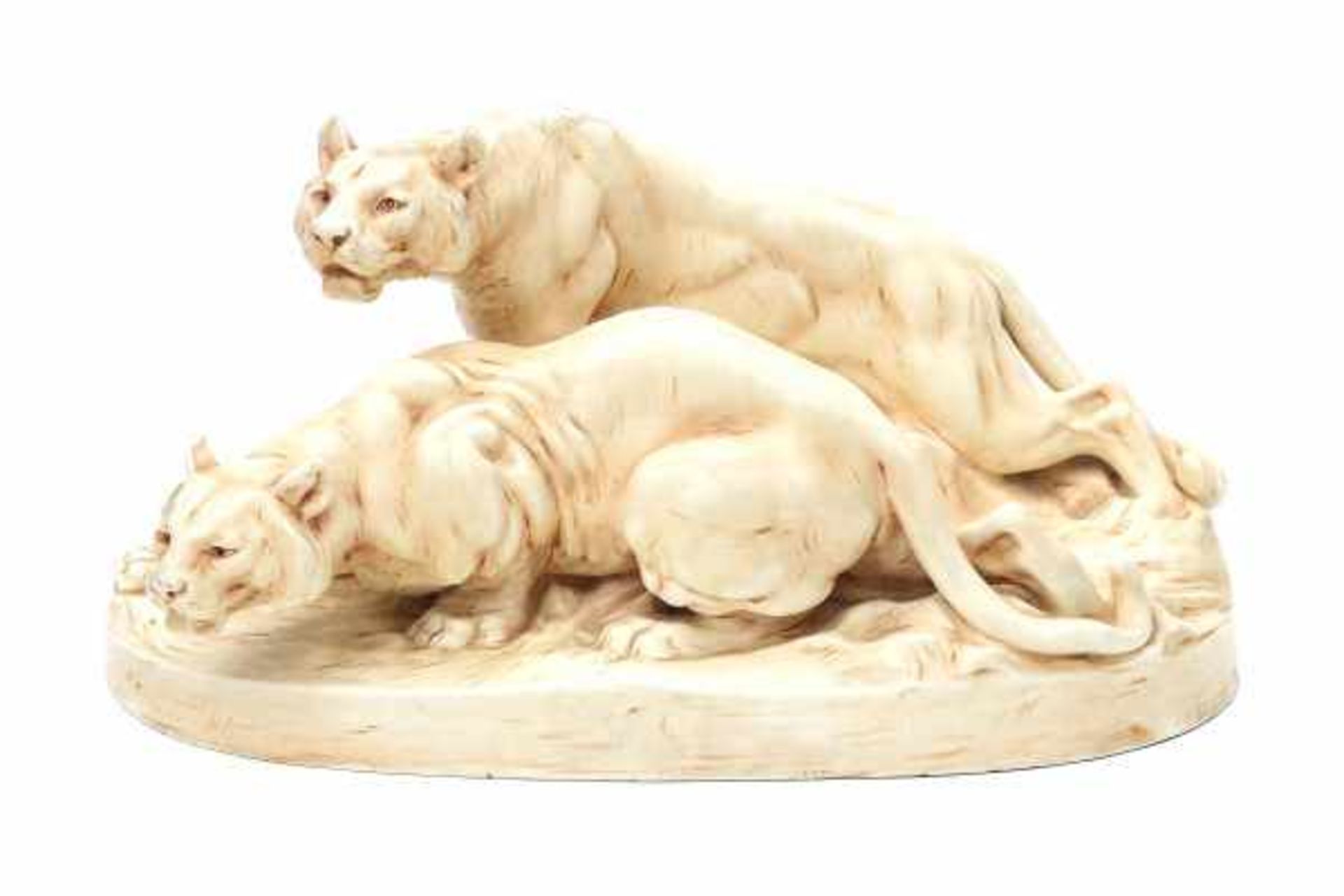 Royal Dux, BohemiaA moulded ceramic group of two lionesses, designed by Otto Jarl (1856-1915),