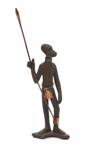 Jaap Ravelli (1916-2011)A ceramic figure of an African warrior, with copperhand spear, fig leaf,