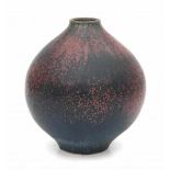 Wendelin Stahl (1922-2000) (attributed)A stoneware vase with purple glaze on a dark ground,